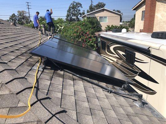 Our Window Technician's cleaning Solar Panels!