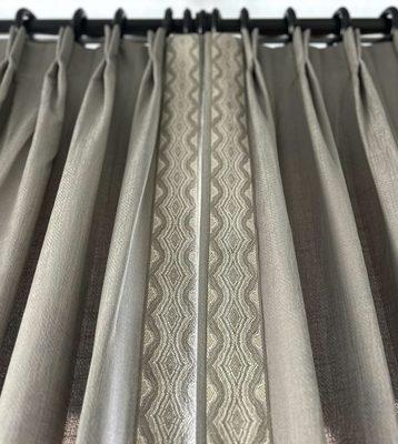 Gorgeous custom drapery with a leading edge trim. Yes, we make custom drapery!