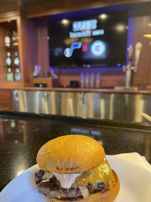 One hamburger slider at the bar.