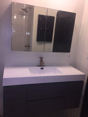 Sink & mirror wall.