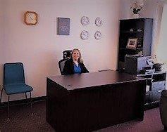 Registered Dietician and Nutritionist (RDN) and Certified Health Coach Carolyn Bouquot at her desk.