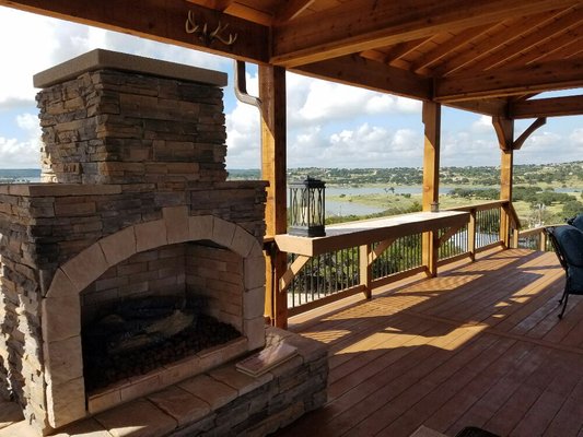 Fireplace on custom cedar deck in Canyon Lake, Texas