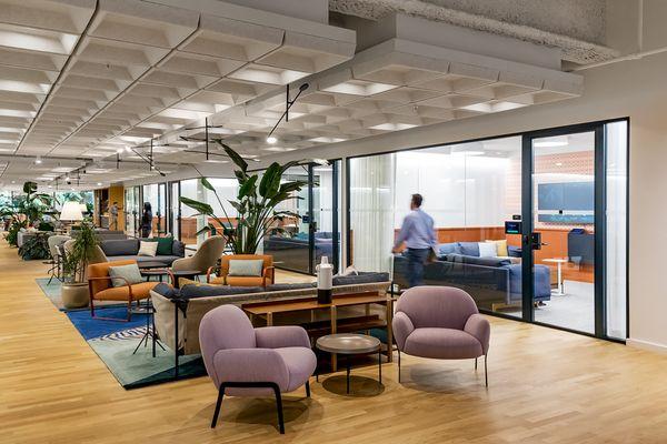 Communal lounge areas between conference rooms and offices