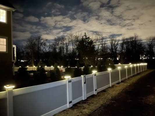 Two tone vinyl fence with wired LED lights