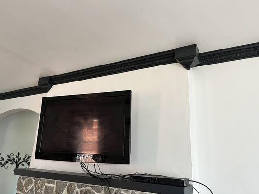 Fireplace trim, wall , ceiling and ceiling trim.