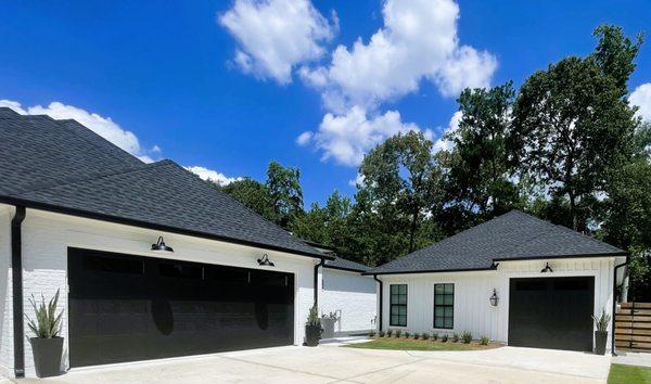 CHI SHAKER STYLE GARAGE DOOR IN BLACK WITH WINDOWS
INSTALLED BY SENTRY GARAGE DOOR TEAM