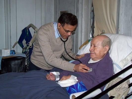 EssenMED House Calls Medical Director Dr. Sumir Sahgal makes a house call to 105-year-old patient, Mr. Leopoldo Imbert.