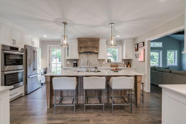 Modern custom kitchen with island seating area.