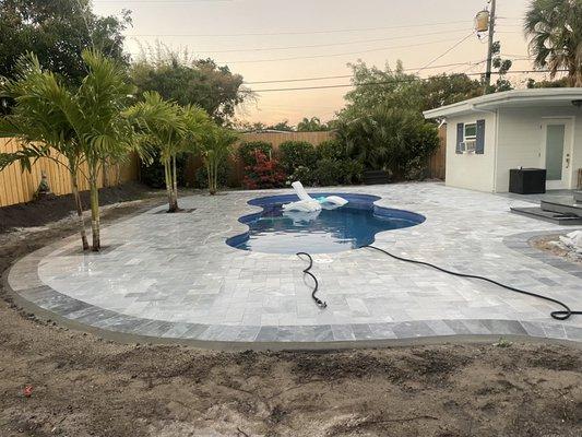 New pool deck 6x12 white deck with 6x12 Tahoe grey borders .