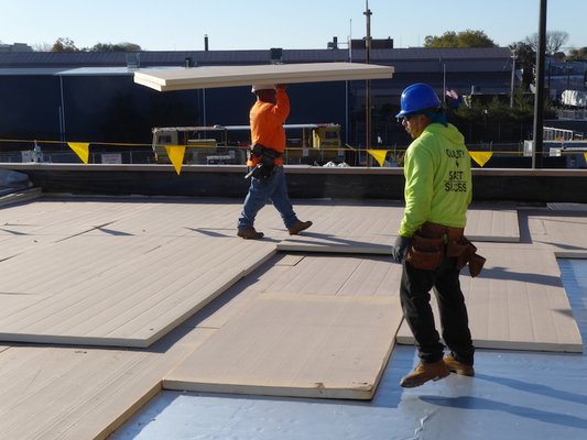 Laying in insulation for a PVC roof in Bridgeport, CT