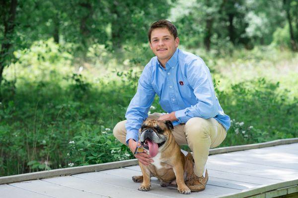 Senior boy portrait with bull dog