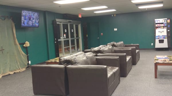 Comfortable seating in the waiting area with WiFi and Cable sports channel!