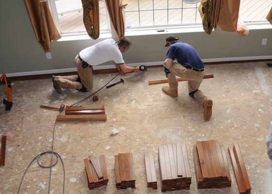 Installing new hardwood floors in process