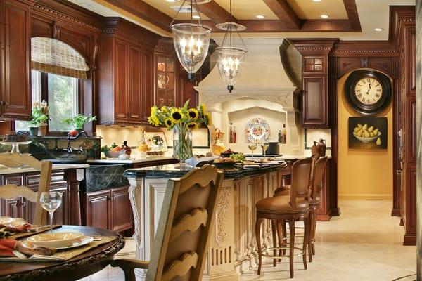 Kitchen renovation.  total change adding full range & hood where ovens once were, new cabinetry, island and ceiling design.