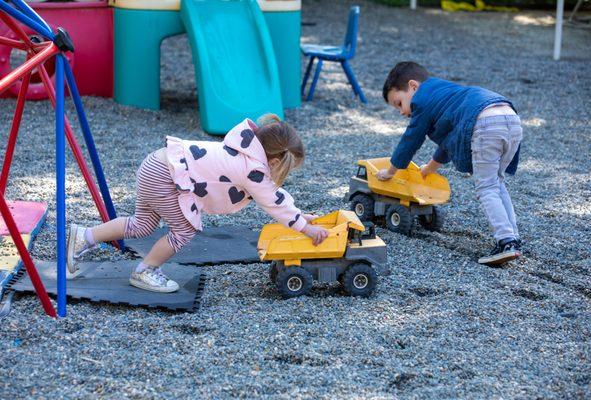 Big work getting done during outdoor playtime.