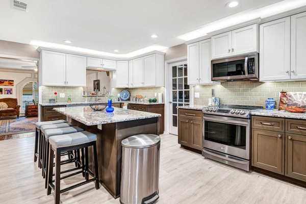 Kitchen / Breakfast re-design. Removal of walls, all wood cabinets, granite countertops, tile backsplash, vinyl plank flooring and paint.