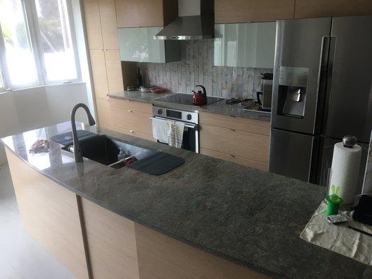 Kitchen counters in "Ocean Green" stone.