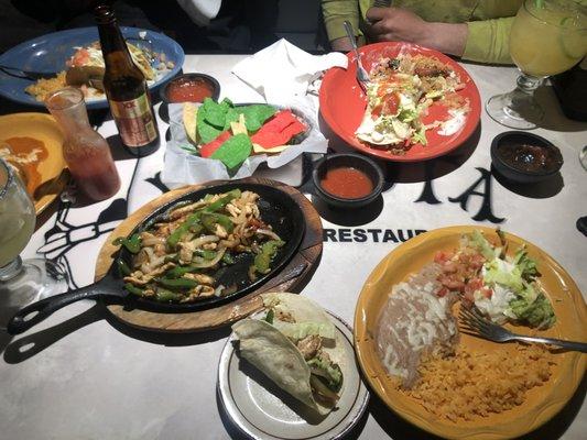 Chicken fajitas (center bottom), Fajita burrito (top right)