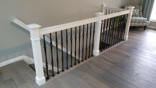 Custom balcony rail and hardwood floor installation.