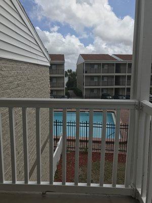 View from one of the second floor buildings looking at the pool and between the building is the bay water where the dock is