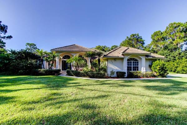 This gorgeous 3 bedroom 2 bath home sits on a fully fenced 2 acre lot that backs up to a canal for ultimate privacy...