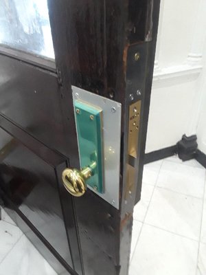 Custom made plat to support mortis lock and door repair