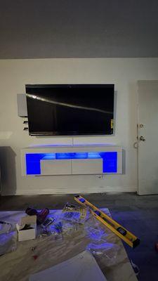 I love the work! He assembled and installed the tv stand with tv, also ps5 behind tv with led lights