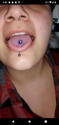 Crooked tongue piercing