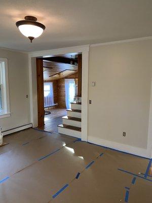 Painted walls and trim. Newly finished floors were protected during the process.