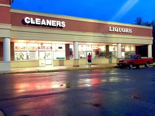 Front of the dry cleaner next to liquor store.