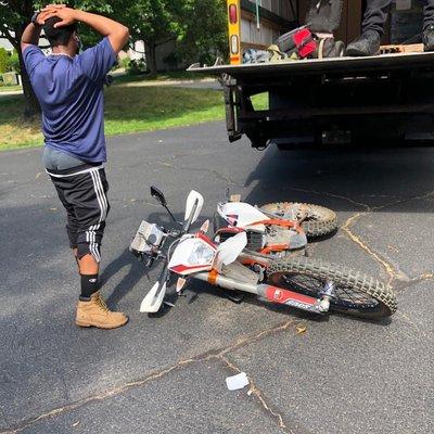 AA motorcycle delivery driver immediately after dropping my bike from the 53" lift gate off the back of the truck.