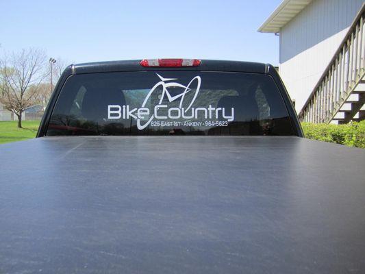 Logo applied to back window of pickup for a bike shop.