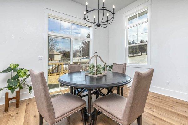 Dining room furniture, flooring, and chandelier