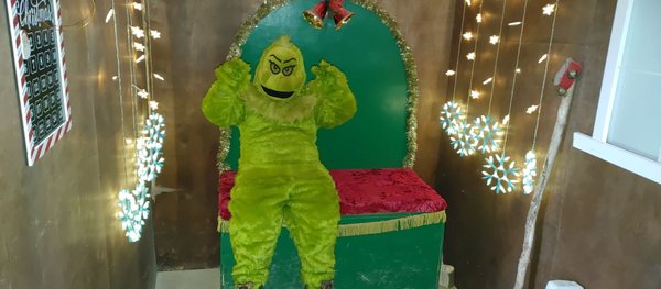 The Grinch in Santa's throne room.