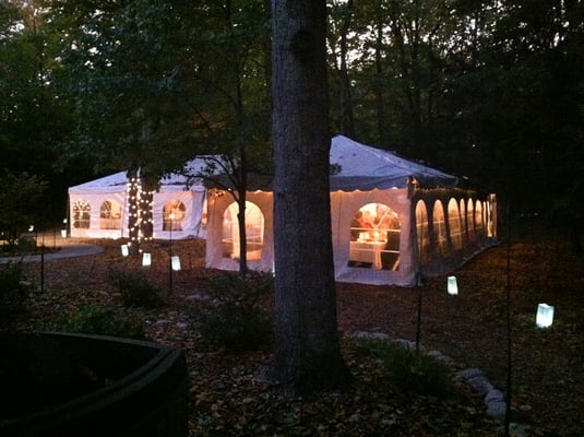 Tent exterior at dusk.