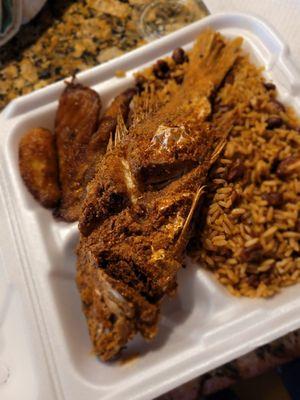 Red snapper, peas and rice and plantain close-up.