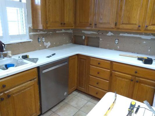 Before picture of kitchen that we removed some cabinets, added others and then painted.