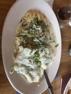 Chicken dish with mozzarella, spinach in a Alfredo sauce over angel hair