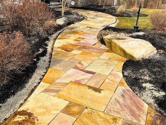 You can choose the perfect stone color and design pattern for your custom walkway and other hardscapes to highlight your landscape design.