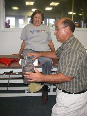 PT Robert Rodriguez working with a patient.