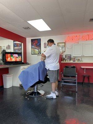 Mr Karl cutting my kids hair. We love him!