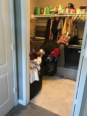 Laundry room full of clean clothes.