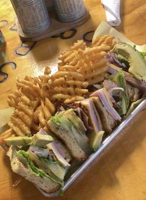 Club sandwich with waffle fries