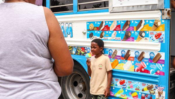 A happy customer enjoying their snow cone!