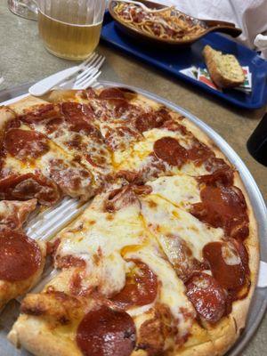 Medium pepperoni pizza and spaghetti with meat sauce