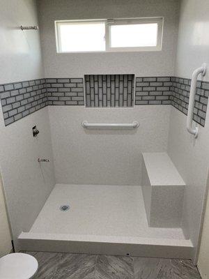 Corian shower with seat and grab bars installed by encounters