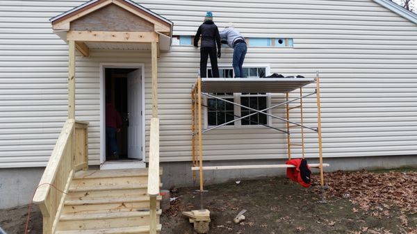 We built the scaffolding, then cut and installed the AC and dryer vents! (At least Sarah and Sue did!)