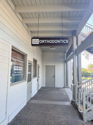 View of the outside hallway with the Design Orthodontics sign visible.