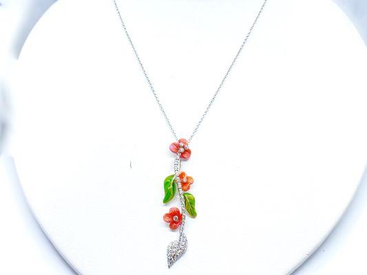 Very unique enameled and diamond drop necklace in white gold.