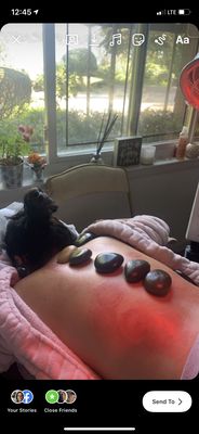 Hot stone therapy , which follows the acupuncture